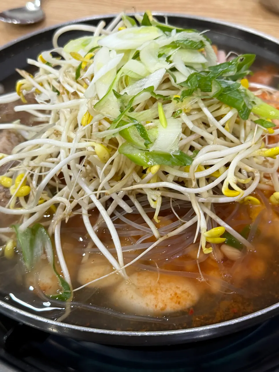 Pot of budae jjigae starting to boil