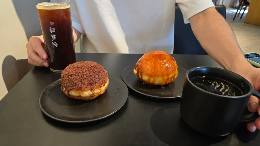 Second floor floor-to-ceiling window seats with ordered doughnuts at Heuksadang