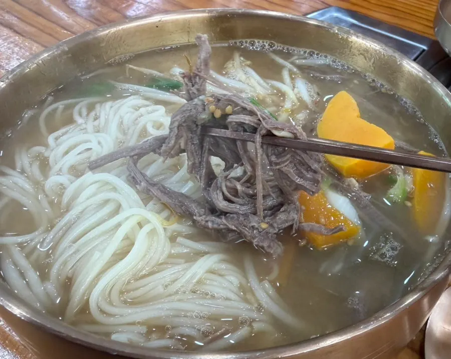 Doenjang guksu with meat and sweet pumpkin