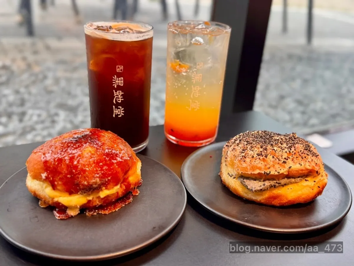 Americano, passionfruit ade, and two donuts