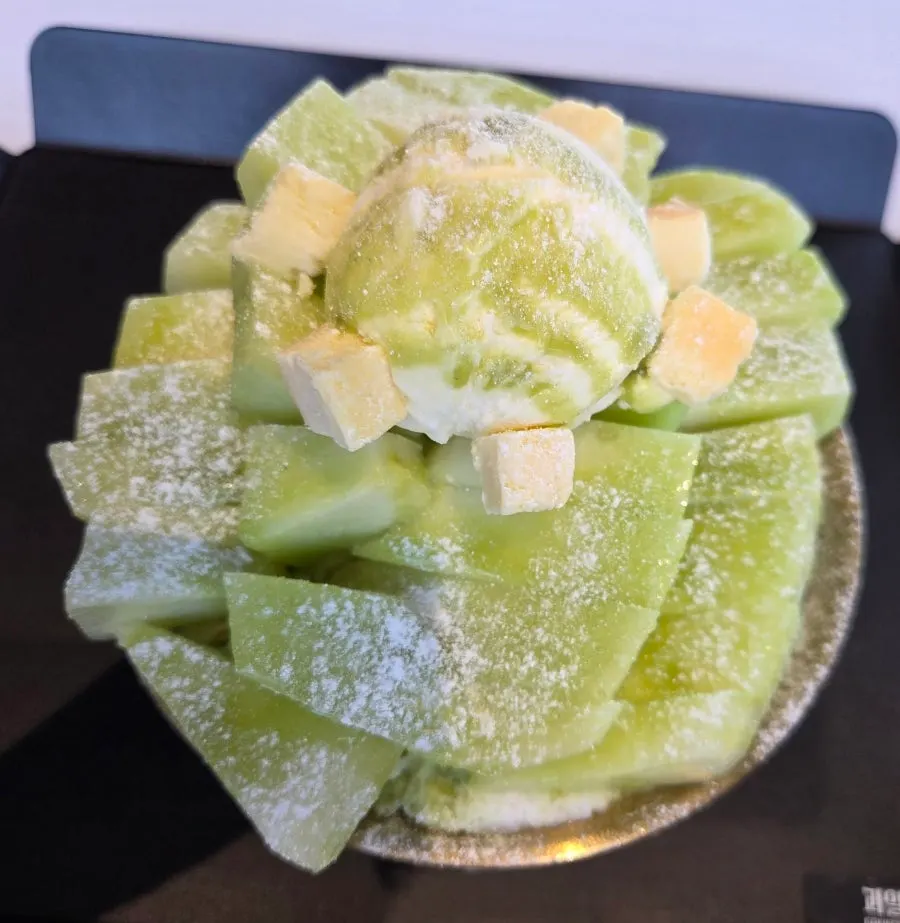 Close-up of neatly cut melon covering the bingsu