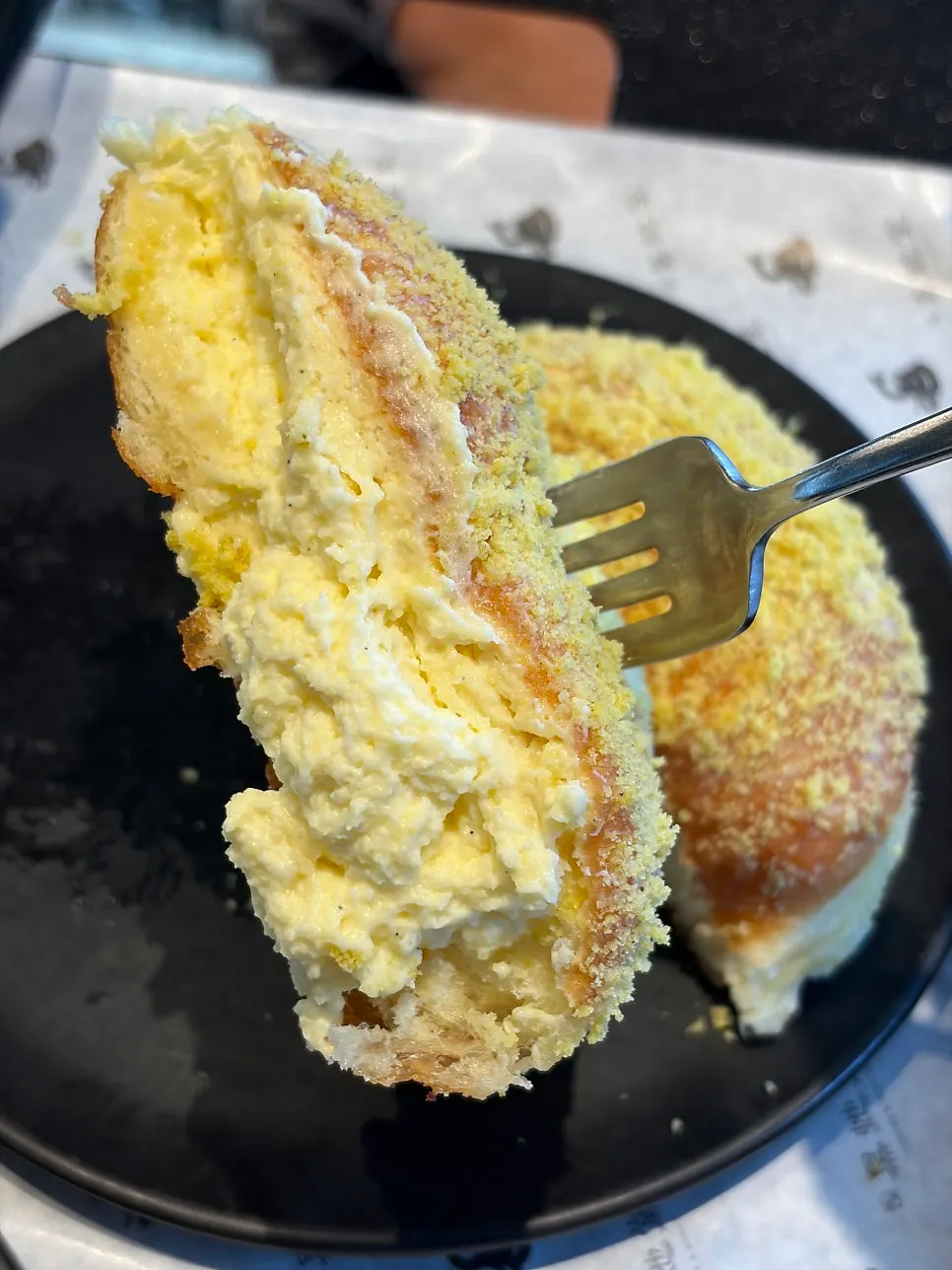 A bite taken out of the lemon doughnut at Heuksadang