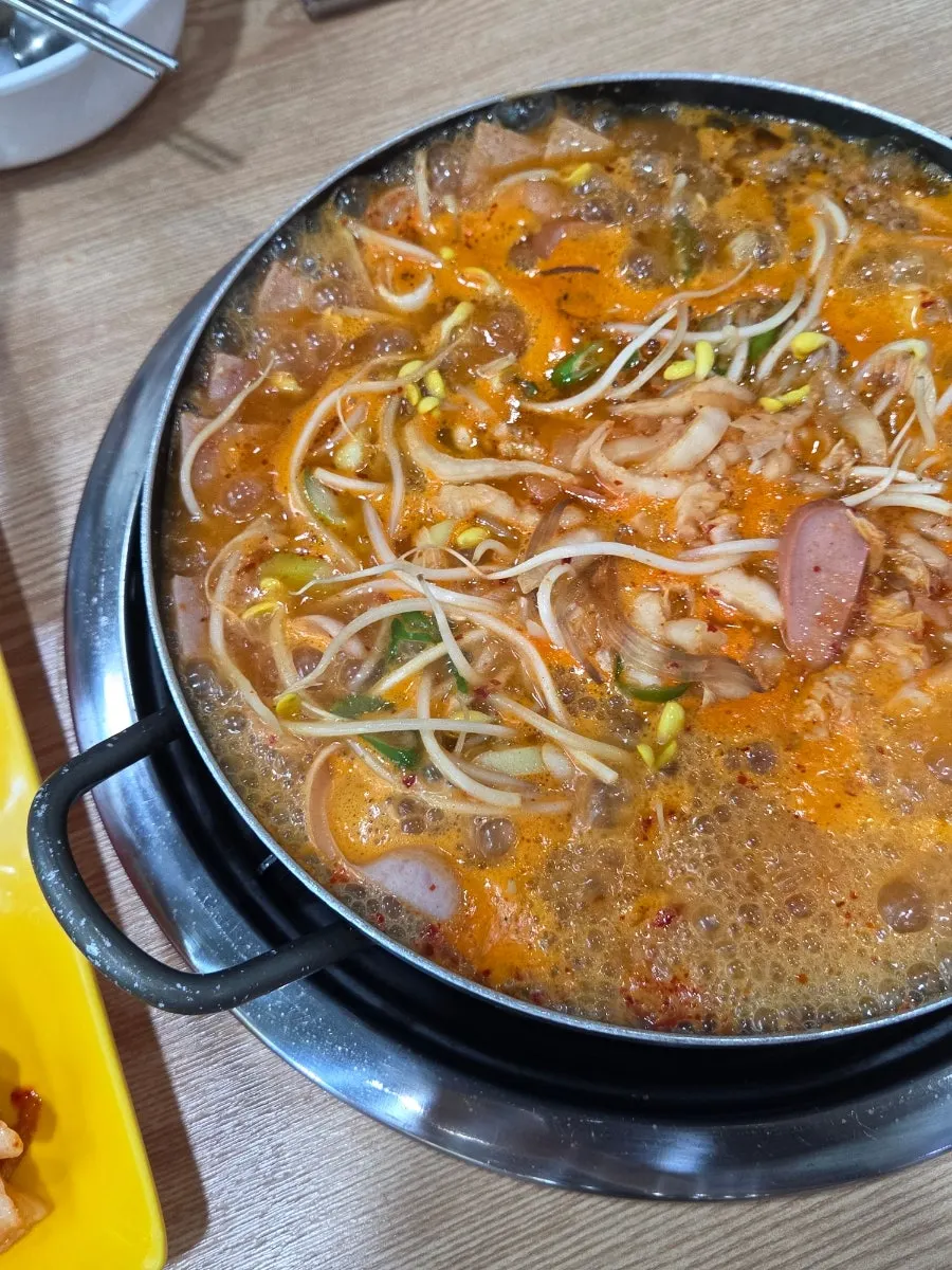 Small plate with ingredients scooped out of the pot