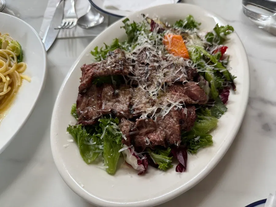 A plate of grilled steak salad