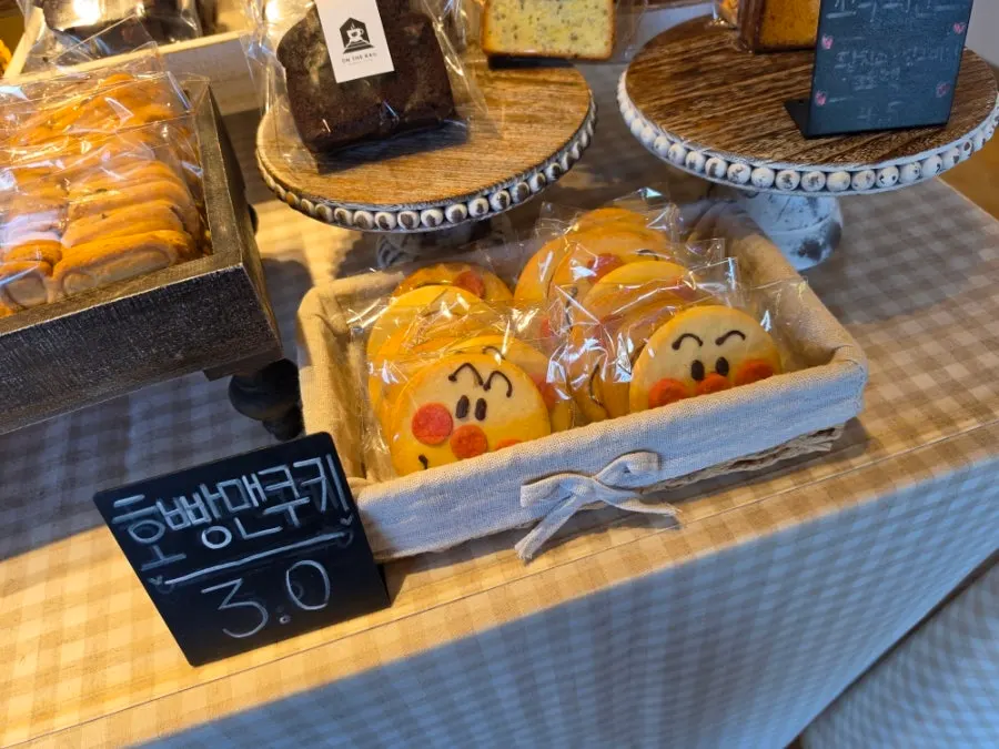 Mocha buns and croissants on the bread display at On the Rail
