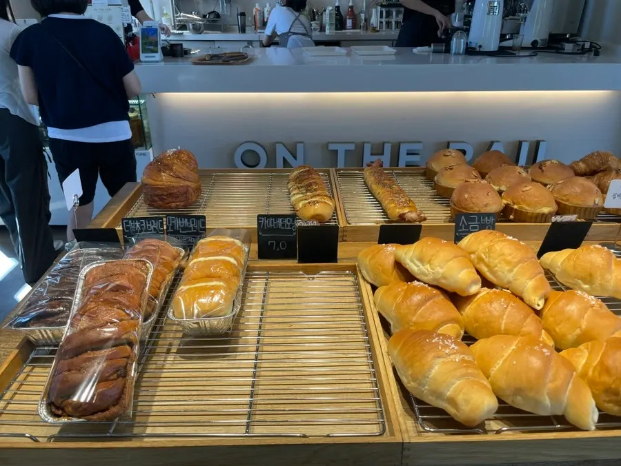 Salt bread and croissants on the bakery shelf
