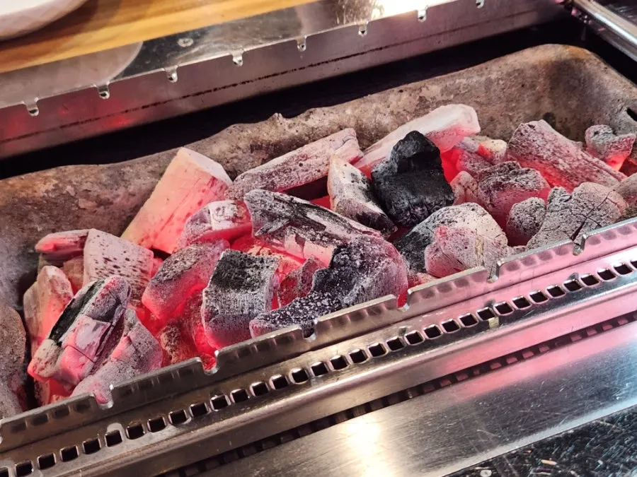 Plate of raw, bright red lamb skewers