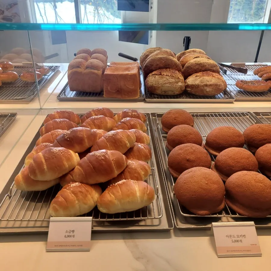 Seasonal fruit croissant and pain d'or topped with mango