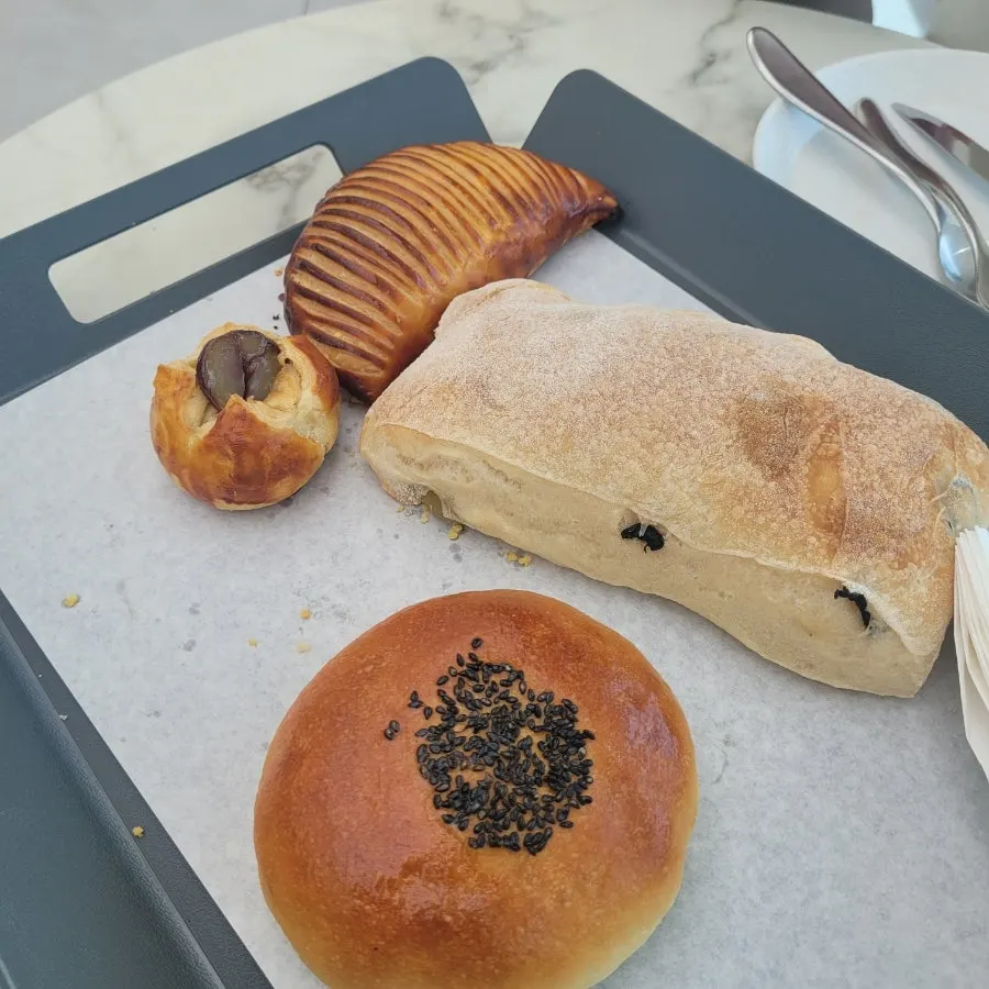 Salt bread and almond mocha bun on display