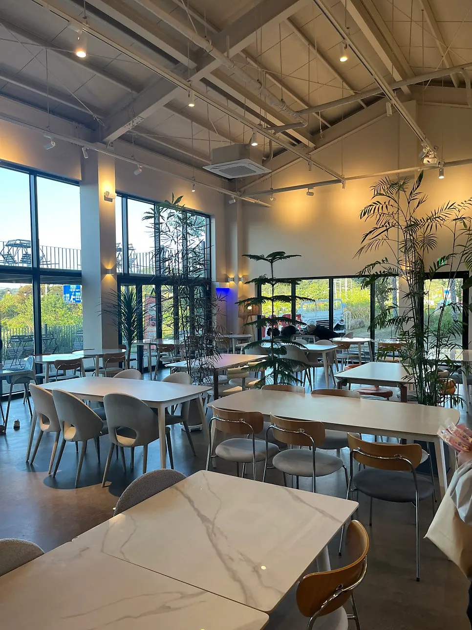 Tables and lighting inside On the Rail café