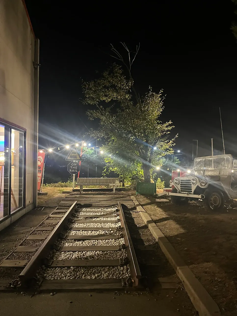On the Rail café lit up at night