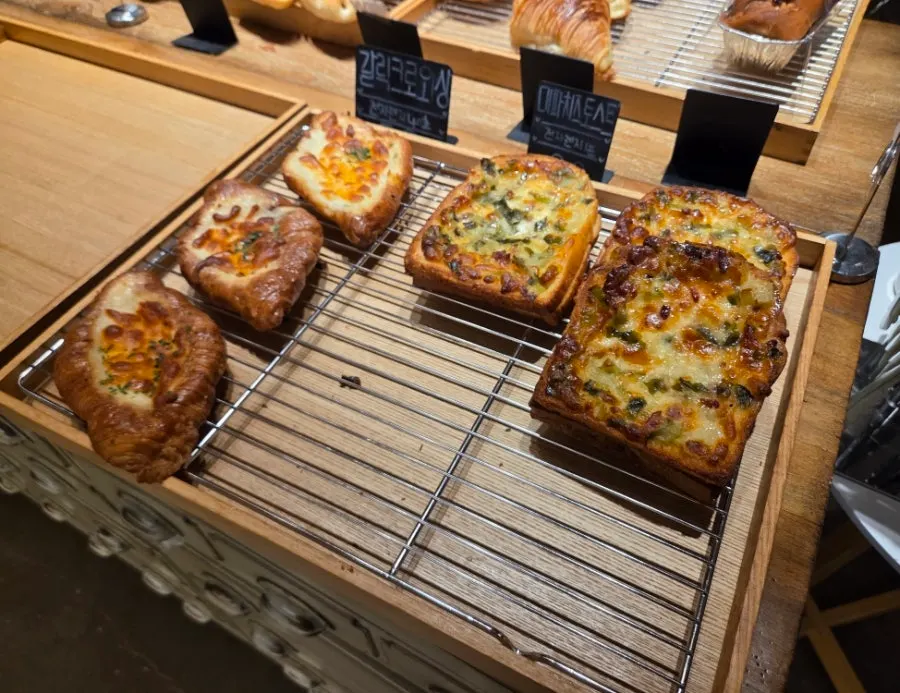 Breads displayed on On the Rail's bakery shelves