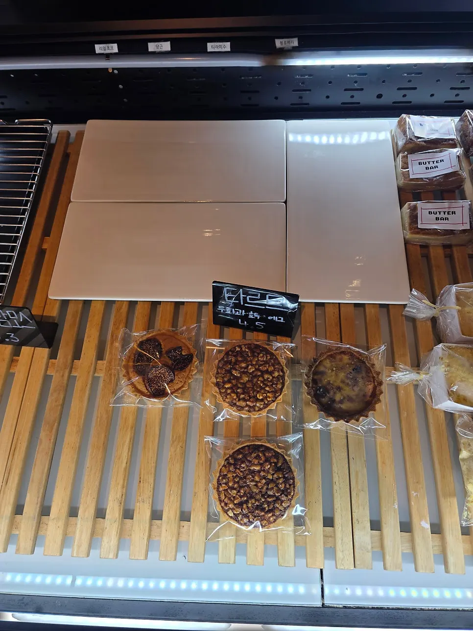 Tarts and financiers displayed at On the Rail