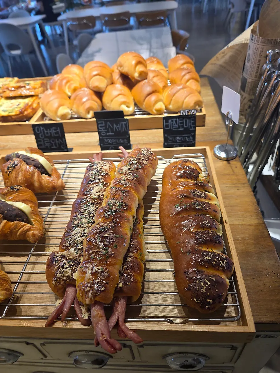 Long sausage bread and basil tomato bread on display
