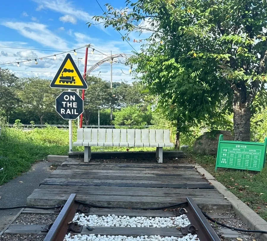 Overview of On the Rail, a train-themed outdoor café in Munsan, Paju