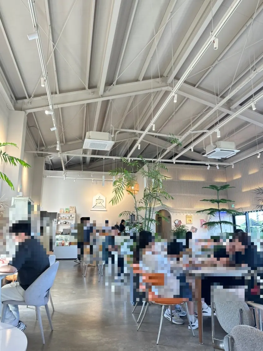 High-ceilinged indoor seating at On the Rail