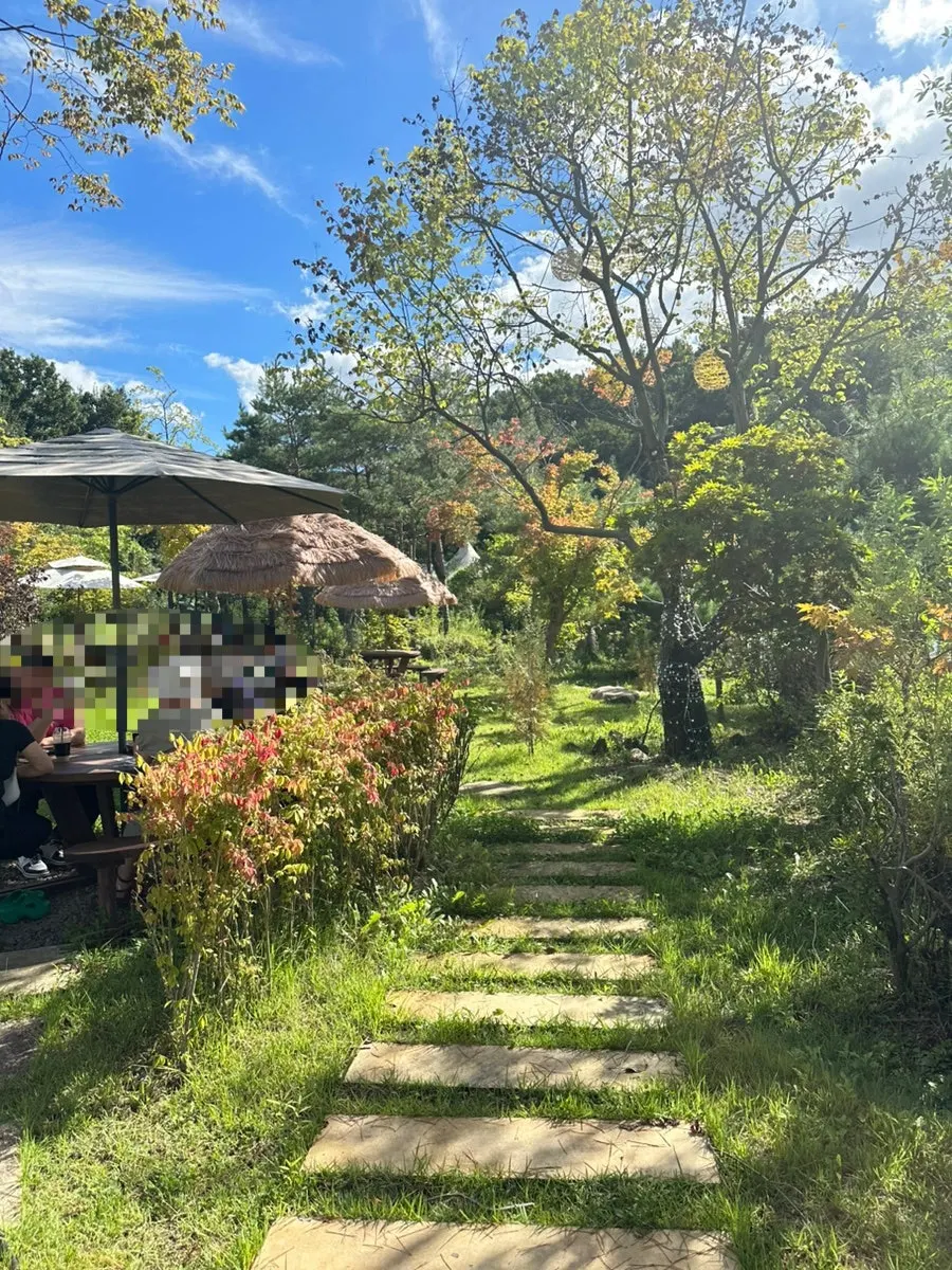 Outdoor tables and garden at On the Rail