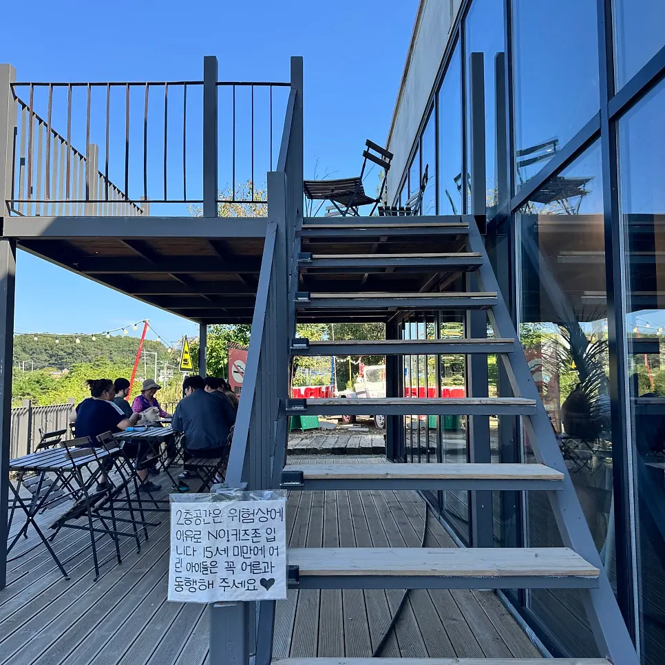 2nd-floor outdoor seating at On the Rail with a railing installed