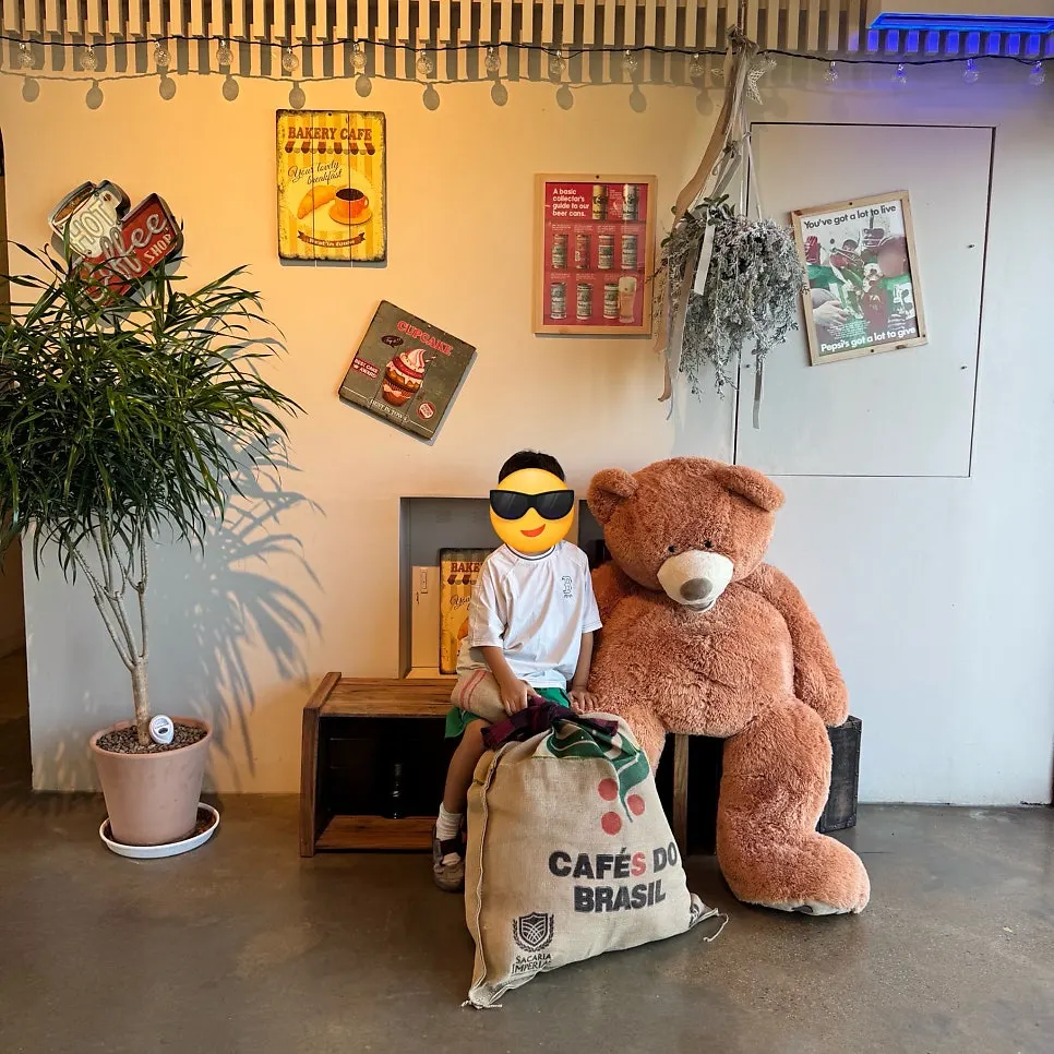 A giant teddy bear doll that looks like On the Rail's mascot