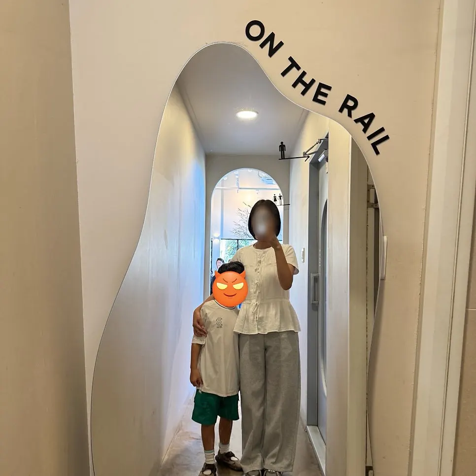 Full-length mirror photo spot in front of the restroom