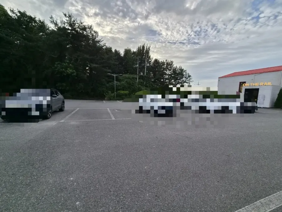 On the Rail's dedicated parking lot under the sky
