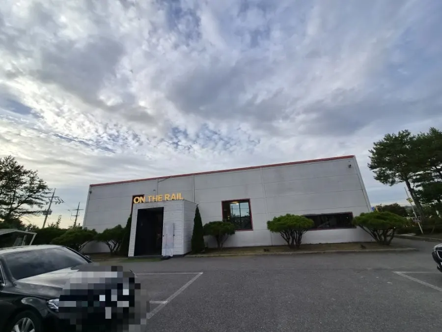 View of the On the Rail building from the parking lot