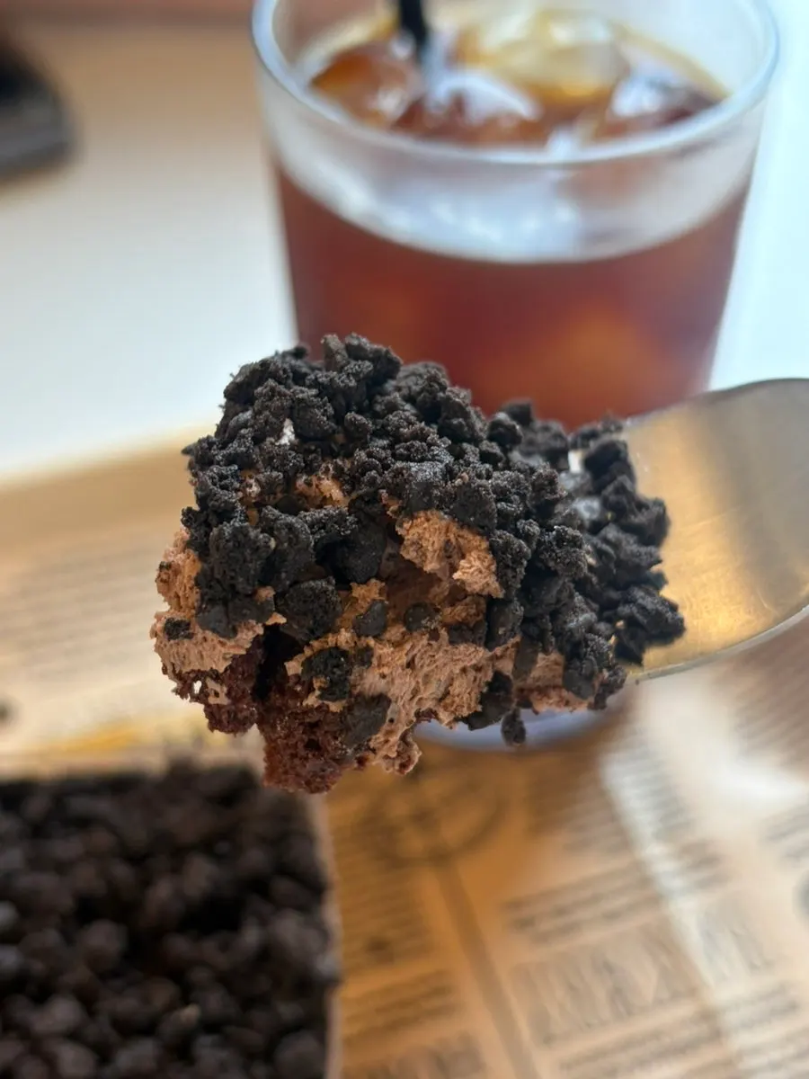 Chocolate bottle cake topped with cookies-and-cream cookie
