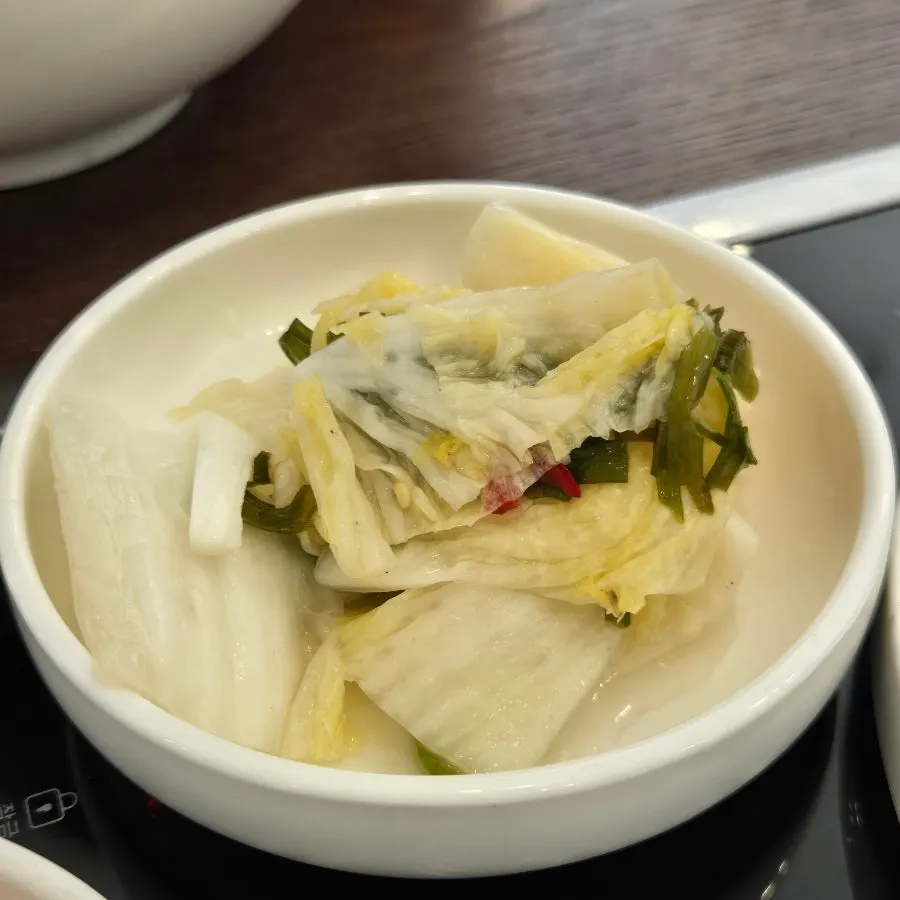 Close-up of noodles lifted from the Pyeongyang water makguksu