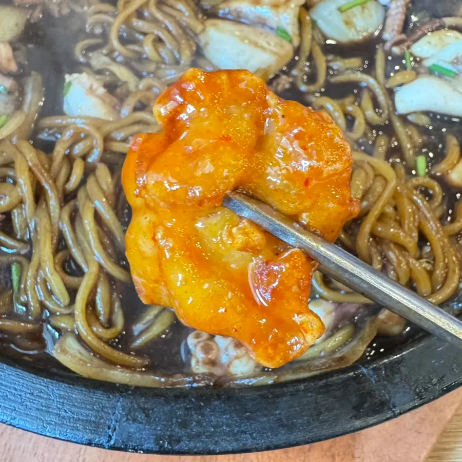 Crispy-outside, tender-inside pork cutlet dipped in sweet and sour sauce