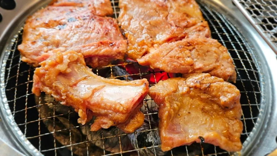 Close-up of glossy, cooked marinated pork ribs