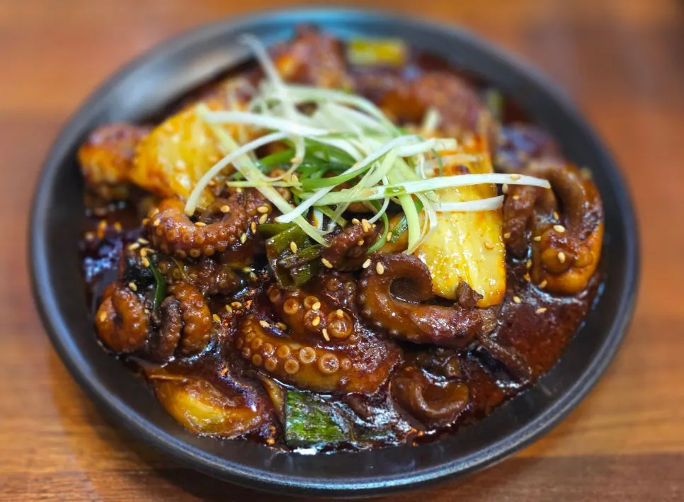 A plate of stir-fried octopus in red sauce