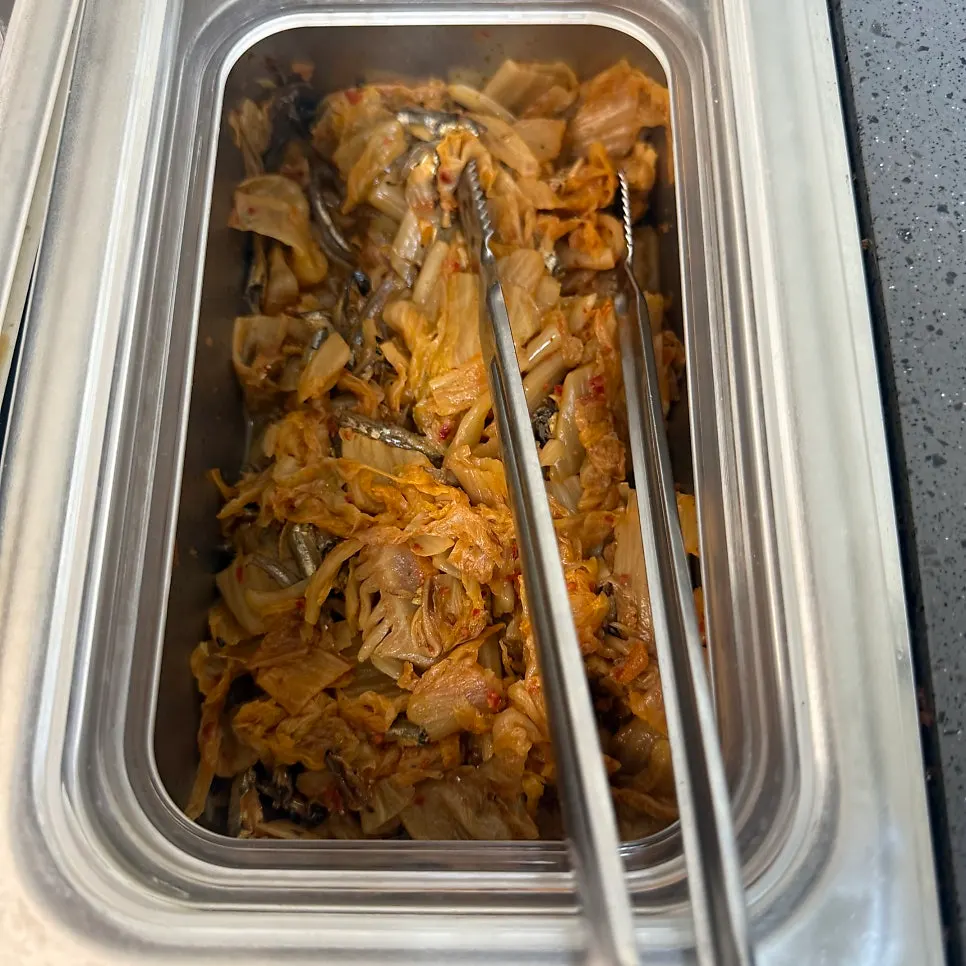 A plate filled with 8 types of wrap greens