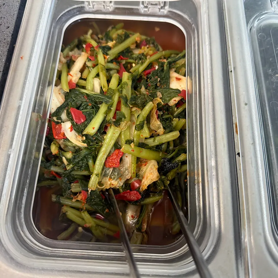 Wrap greens and side dishes gathered from the self-serve bar