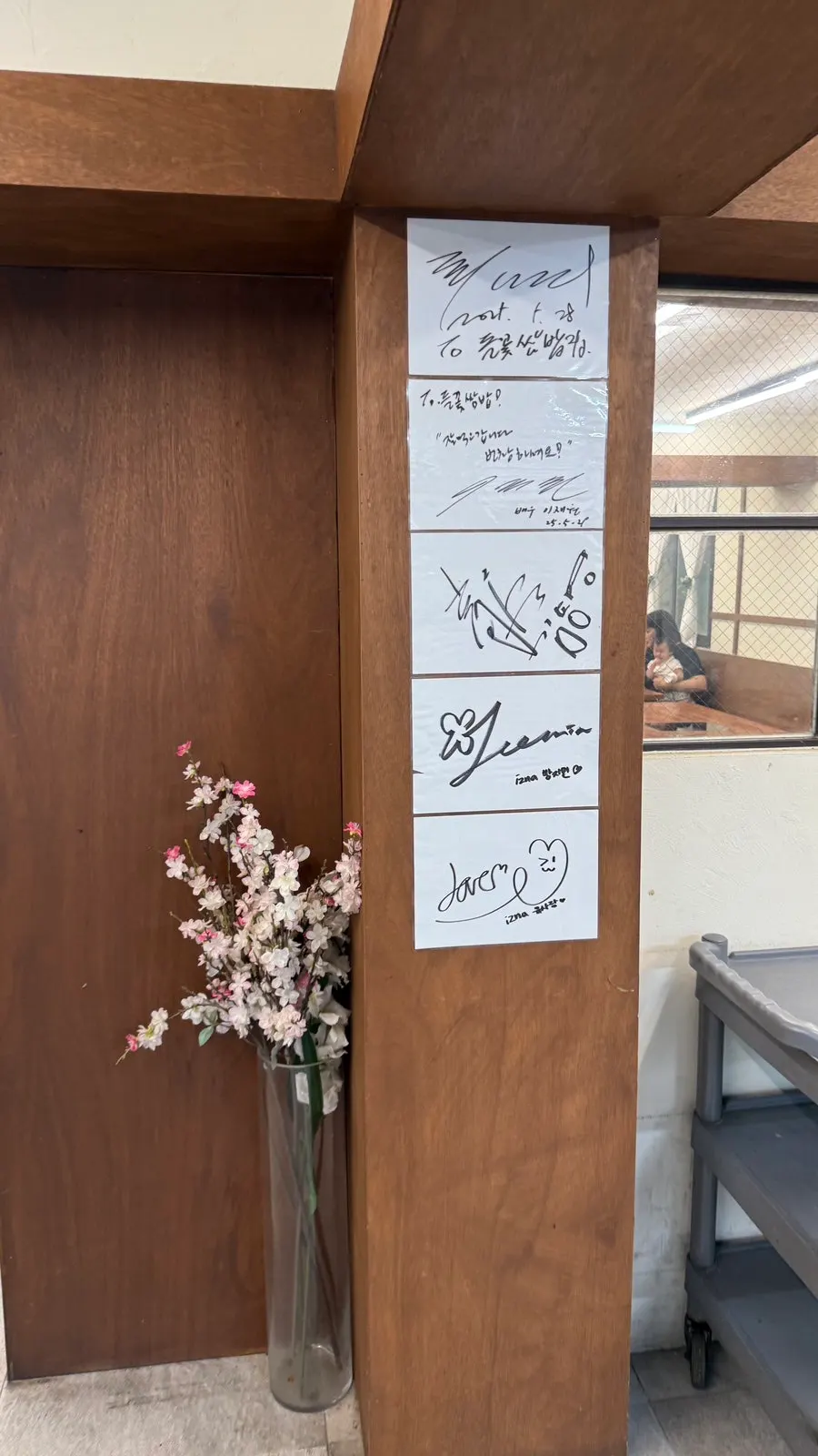 Celebrity autographs hanging near the restaurant entrance