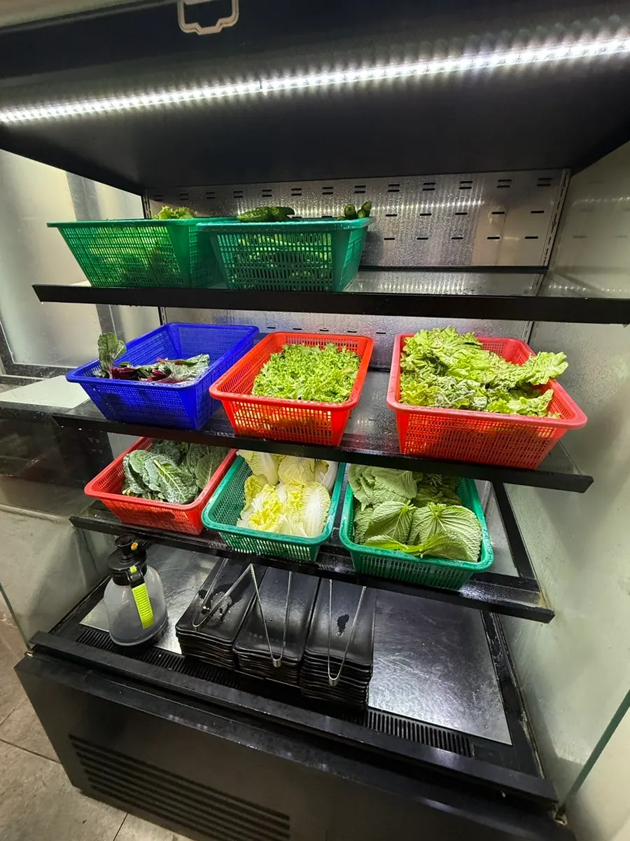 Self-serve bar with ssam vegetables laid out