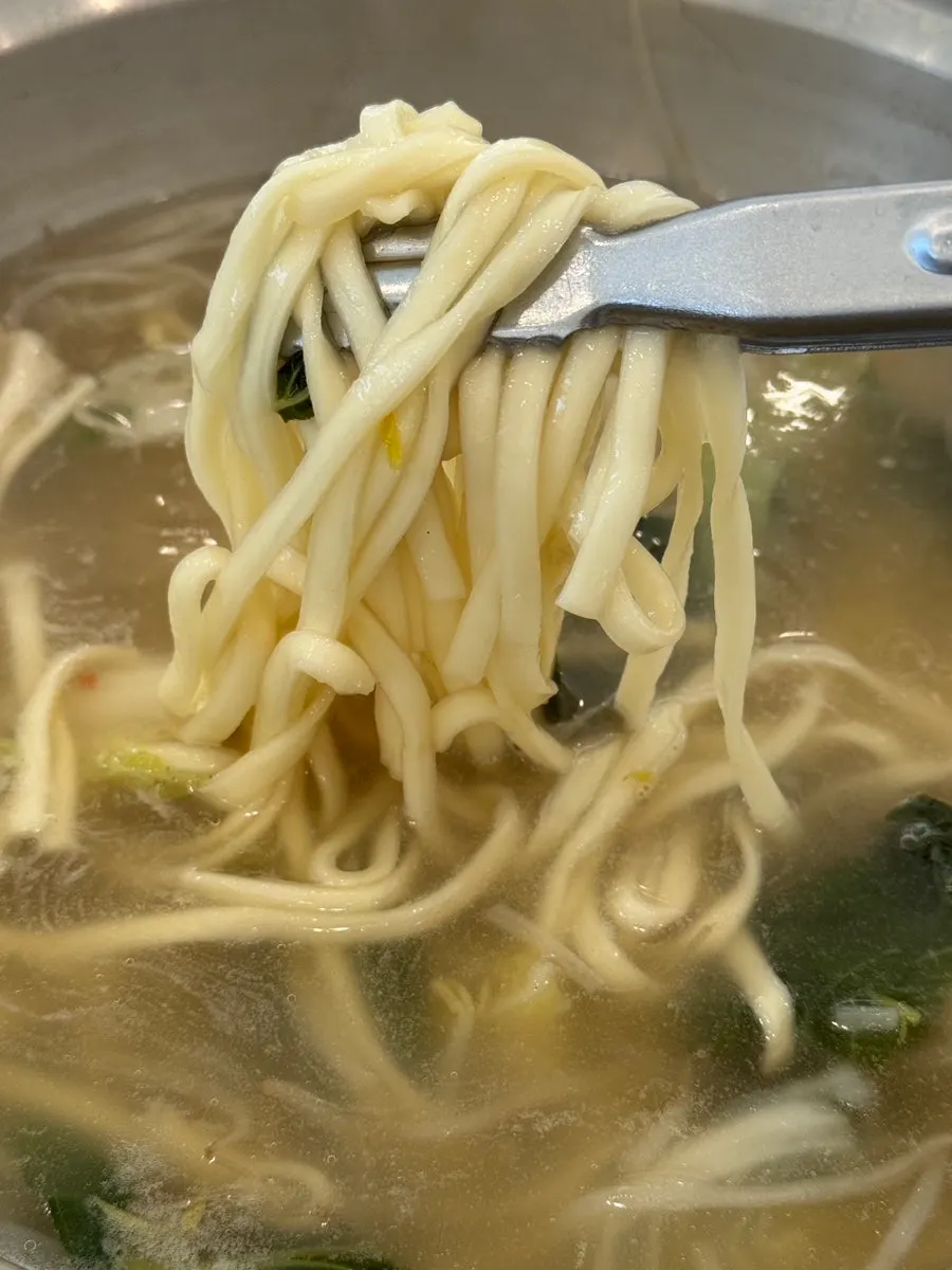 A bite of Pyeongyang mandu with mild, savory juices
