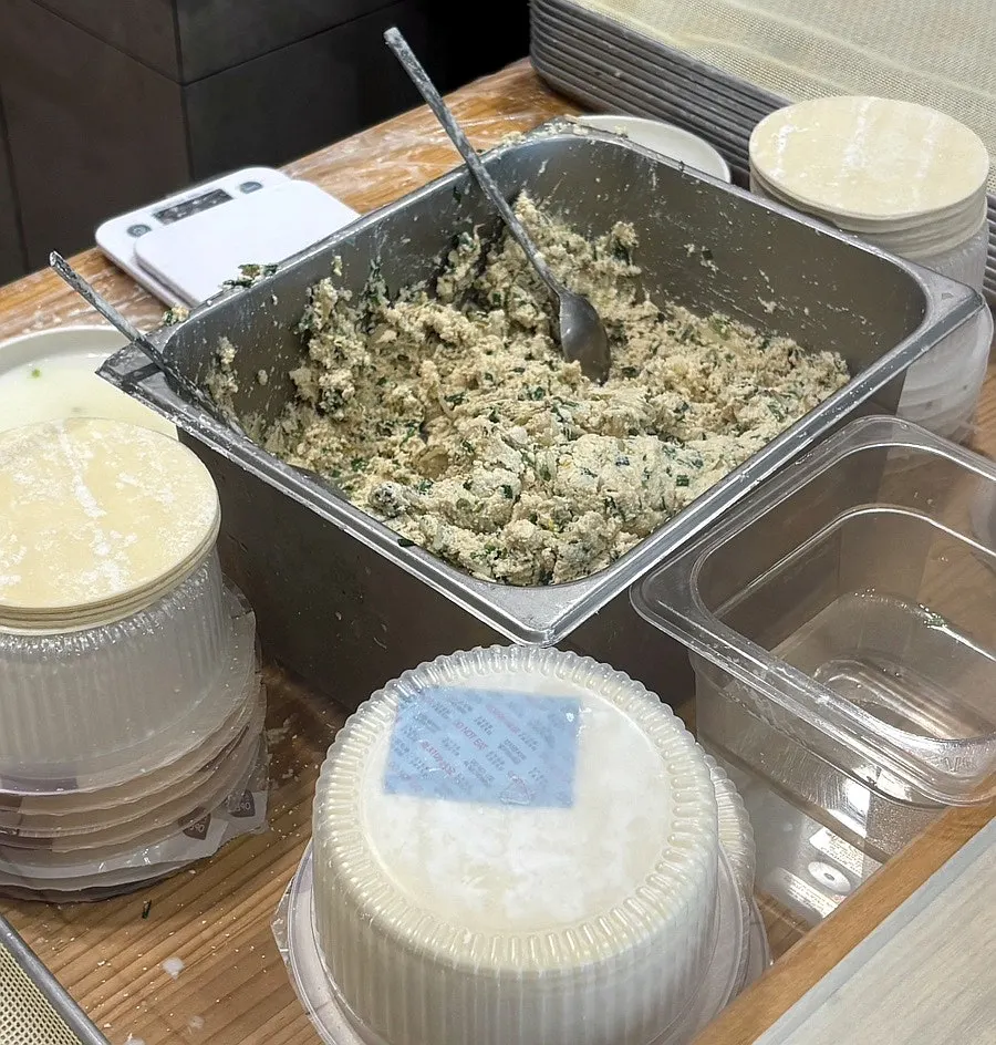 Self-serve bar and mandu-making station at the center of the restaurant