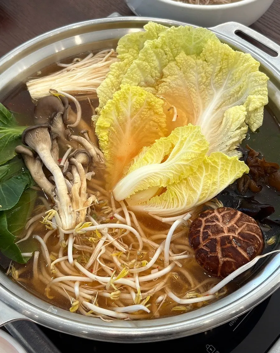 Vegetables and mushrooms added to the broth