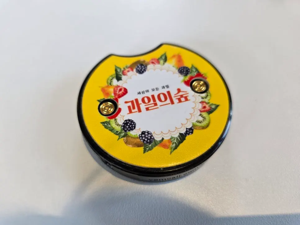 Yellow buzzer with fruit illustrations