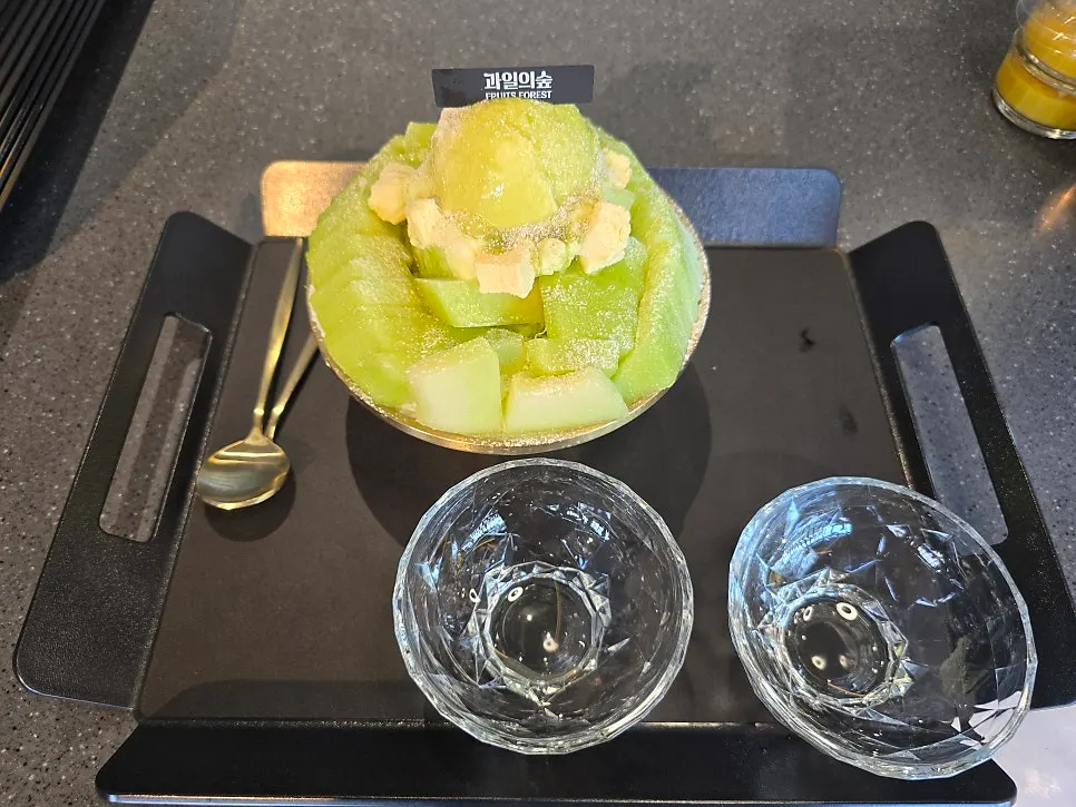 Melon snow bingsu with crystal glass bowls and gold spoon