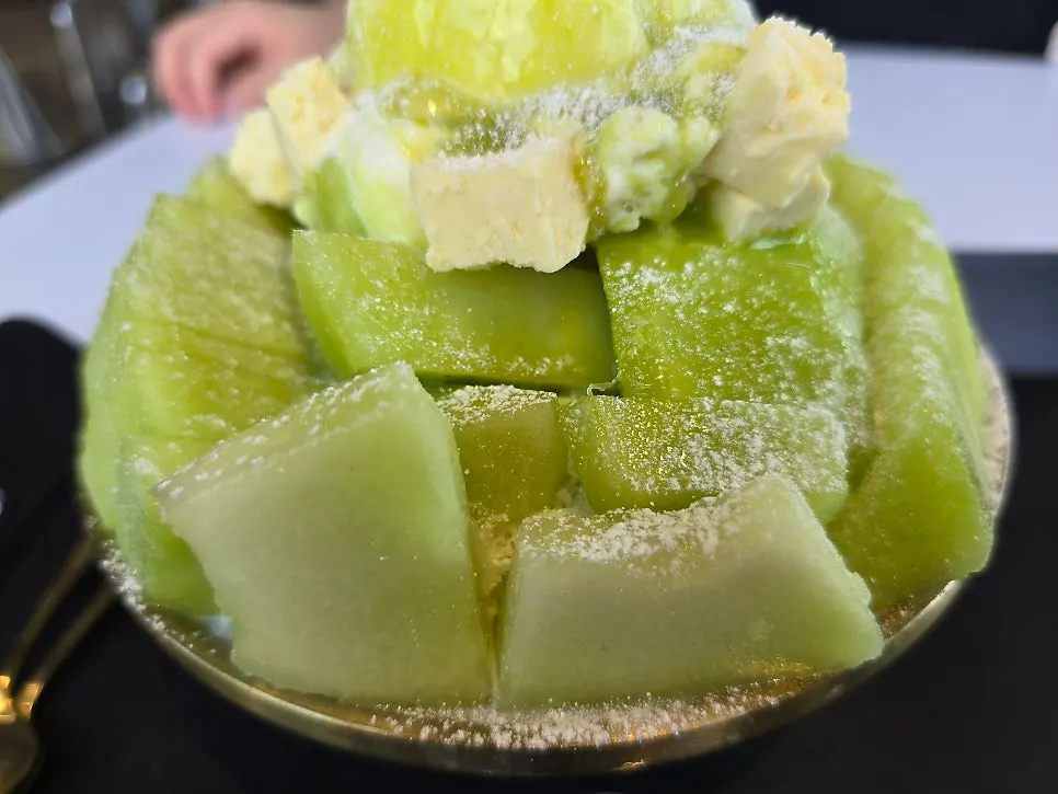 Melon ice cream and cheesecake cube toppings