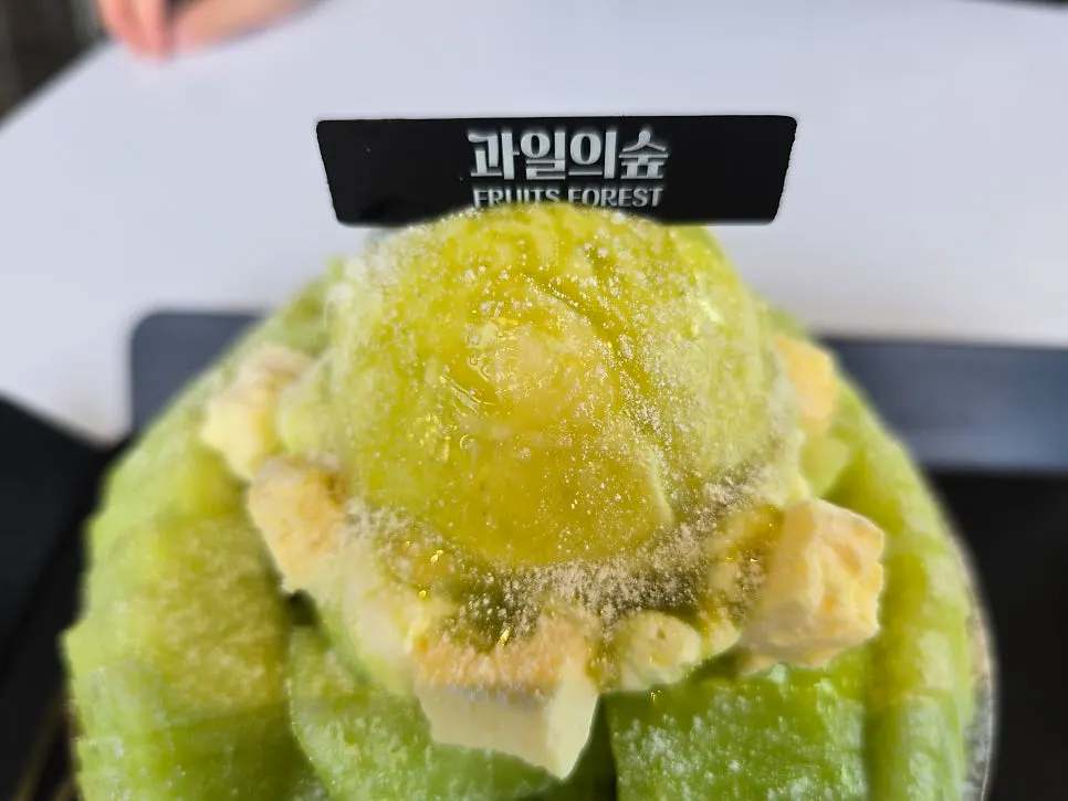 Top of the melon bingsu dusted with powdered sugar