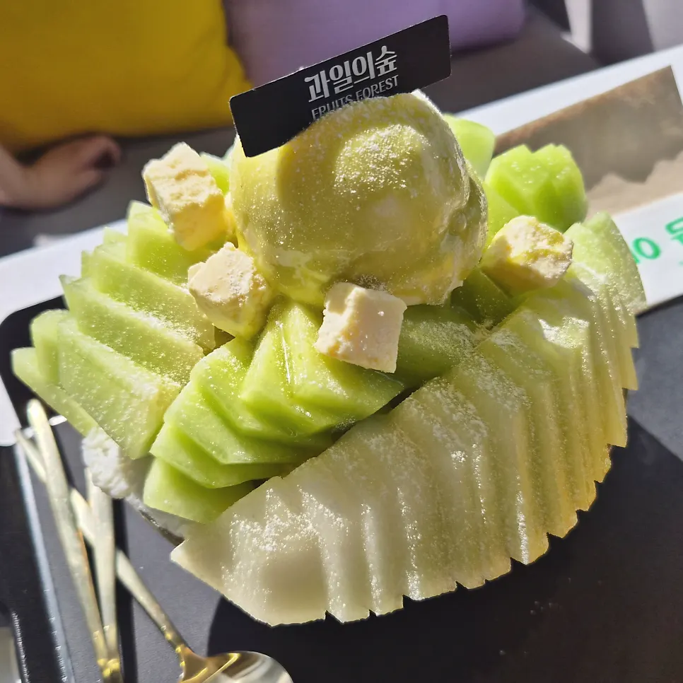 Melon snow bingsu topped with a whole melon