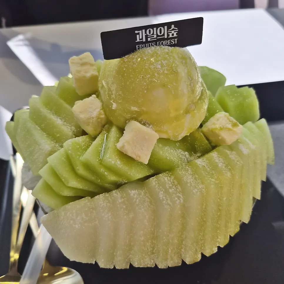 Bingsu topped with melon ice cream and cheese