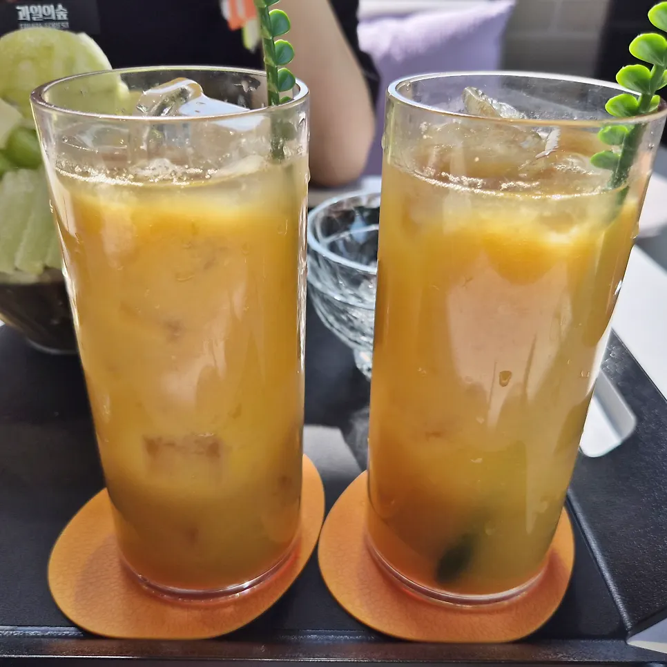 Two cups of 1+1 fresh mango juice