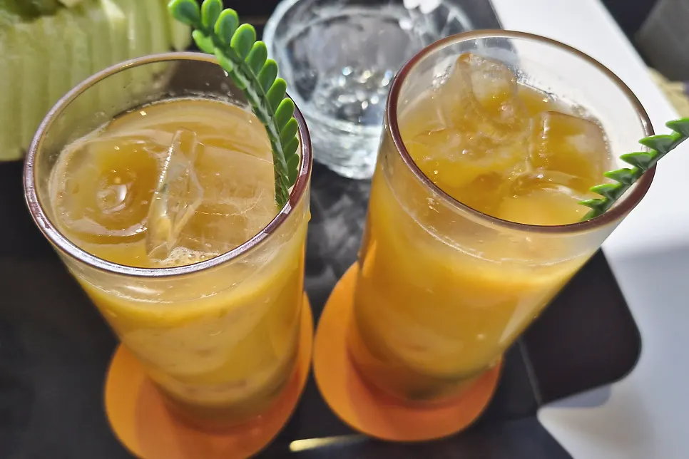 Deeply colored fresh mango juice
