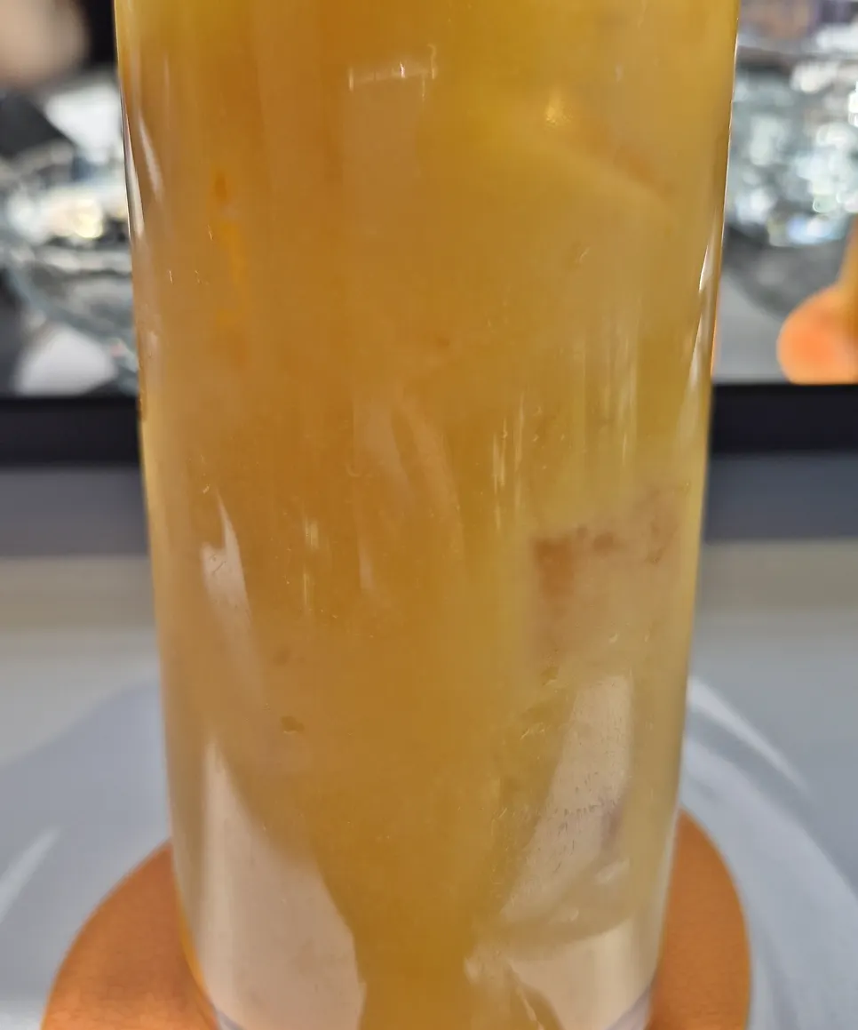 Close-up of a cup of fresh mango juice