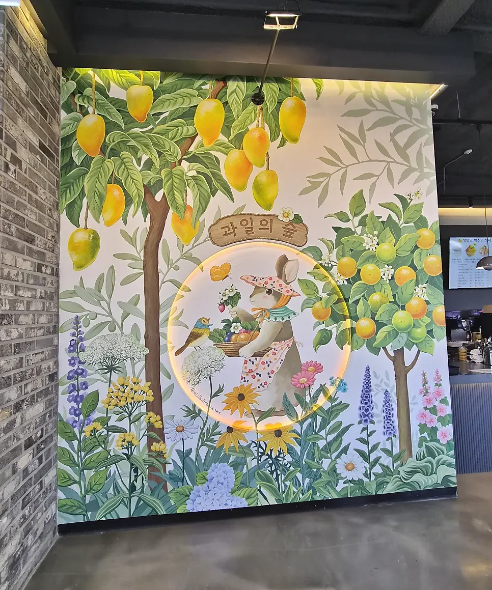 Photo zone and sofa seating inside the Fruit Forest café