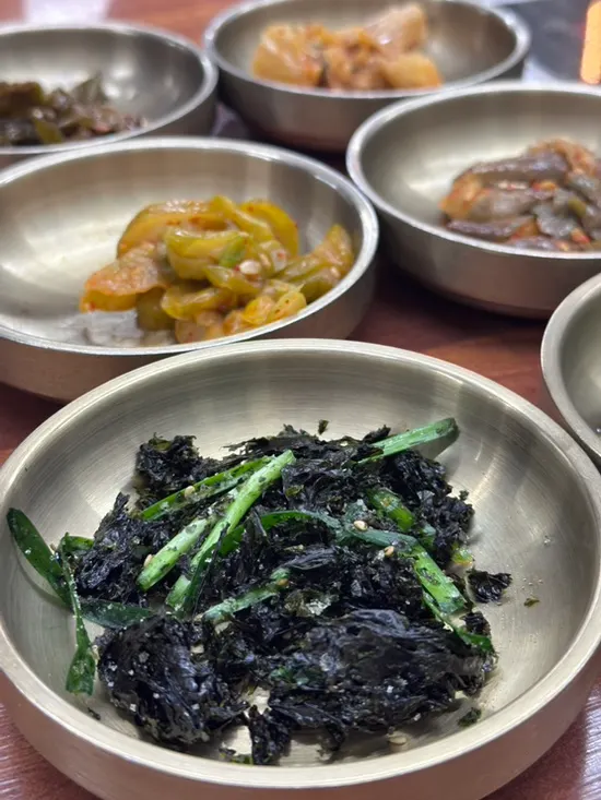 Basic side dishes including stir-fried anchovies with chili and aged kimchi