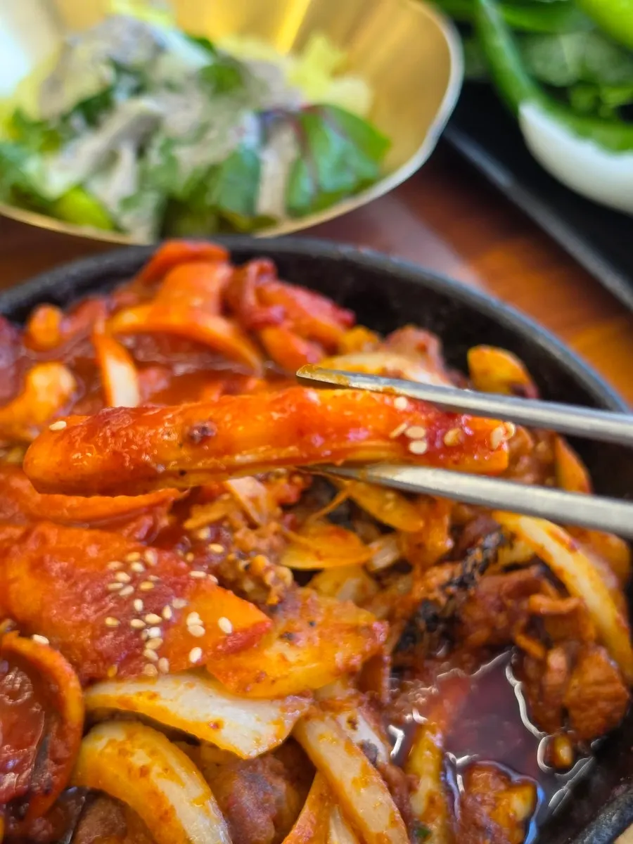 Mildly seasoned banchan alongside a bowl of rice